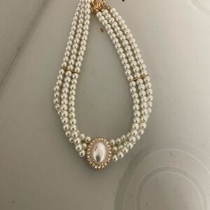 Elegant Pearl Necklace with Gold Accents